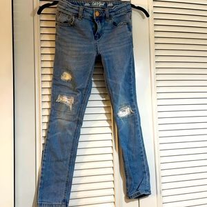 Cat & Jack “torn” jeans with flipping sequins in the “tears”.  Girl size 7.